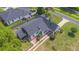 Aerial view showcases a well-maintained property with a large yard, mature trees, and neighborhood views at 2101 Lily Ct, Sanford, FL 32771