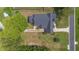 Overhead shot of the well-maintained property highlighting the unique roofline and lush surroundings at 2101 Lily Ct, Sanford, FL 32771