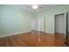 Bright bedroom features wood floors and streams of sunlight from the large windows at 2101 Lily Ct, Sanford, FL 32771