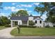 Charming home featuring unique architectural elements and well-maintained landscaping at 2101 Lily Ct, Sanford, FL 32771