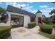 Charming home featuring unique architectural elements, a portico, and a red front door at 2101 Lily Ct, Sanford, FL 32771