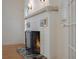 Living room fireplace showcasing white brick and colorful tiled hearth at 2101 Lily Ct, Sanford, FL 32771