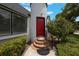 Charming home featuring a unique architectural design and a red front door at 2101 Lily Ct, Sanford, FL 32771