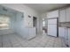 Updated kitchen with tile floors, ample white cabinetry, and bright natural lighting at 2101 Lily Ct, Sanford, FL 32771