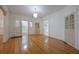 Spacious living room features bright hardwood floors, elegant lighting, and a neutral color palette at 2101 Lily Ct, Sanford, FL 32771