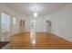 Bright living room with hardwood flooring, lots of natural light, and access to other rooms at 2101 Lily Ct, Sanford, FL 32771