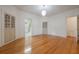 Sun-drenched living room with hardwood floors, bright paint, and multiple entrances at 2101 Lily Ct, Sanford, FL 32771