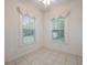Bright room with tile flooring, two windows, and neutral paint throughout at 2101 Lily Ct, Sanford, FL 32771
