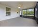 The spacious screened porch has a ceiling fan and access to the backyard at 2101 Lily Ct, Sanford, FL 32771