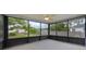 Relaxing screened-in porch offers views of the fenced backyard and lush green surroundings at 2101 Lily Ct, Sanford, FL 32771