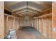 The interior of the shed features shelving, wooden framing, and a small window at 2101 Lily Ct, Sanford, FL 32771