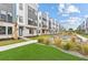 Beautiful townhome community with manicured landscaping, palm trees, and modern architecture at 2217 Valentine Aly, Orlando, FL 32804