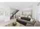 Open-concept living room with hardwood floors, modern decor, and an adjacent dining area at 2217 Valentine Aly, Orlando, FL 32804