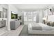 Serene main bedroom with natural light, soft colors, and an en-suite bathroom at 2217 Valentine Aly, Orlando, FL 32804