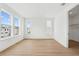 Bedroom featuring three large windows and wood-look floors at 2296 Brix Sts, Orlando, FL 32804