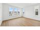 Bright bedroom featuring wood-look floors and multiple windows providing natural light at 2296 Brix Sts, Orlando, FL 32804