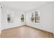 Bright bedroom features wood-look flooring and multiple windows offering an abundance of natural light at 2296 Brix Sts, Orlando, FL 32804
