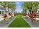 Beautifully landscaped green space with a walkway lined with trees and colorful plants at 2296 Brix Sts, Orlando, FL 32804