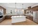 Kitchen with an island, stainless steel appliances and hanging lights above the island at 2296 Brix Sts, Orlando, FL 32804