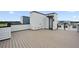 Modern rooftop deck perfect for entertaining, with wood-look flooring and sleek railings at 2296 Brix Sts, Orlando, FL 32804