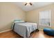 Bedroom featuring laminated floors, standard closet, a ceiling fan and a window with blinds at 2422 Holly Pine Cir, Orlando, FL 32820
