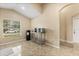 Bright dining area featuring neutral walls, tile flooring, and a stainless steel beverage and snack station at 2422 Holly Pine Cir, Orlando, FL 32820
