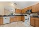 Well-equipped kitchen with oak cabinets, stainless appliances, and an open layout perfect for preparing meals at 2422 Holly Pine Cir, Orlando, FL 32820