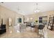 Spacious living area boasts a vaulted ceiling, tile floors, and access to the outdoor patio through sliding glass doors at 2422 Holly Pine Cir, Orlando, FL 32820