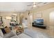 Open-concept living room features modern decor, tile flooring, and a comfortable seating area with natural lighting at 2422 Holly Pine Cir, Orlando, FL 32820