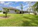 Lush backyard with green grass and privacy fence; perfect for outdoor activities and relaxation at 2588 Gabrielle Woods Pl, Oviedo, FL 32765