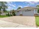 Well maintained home with a three car garage and brick paved driveway at 2588 Gabrielle Woods Pl, Oviedo, FL 32765