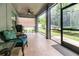 Inviting screened patio featuring tile flooring, outdoor seating, and views of the backyard at 2588 Gabrielle Woods Pl, Oviedo, FL 32765
