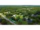 An aerial view showcasing the property's boundaries, lush greenery, and proximity to the surrounding area at 2623 8Th St, Orlando, FL 32820