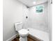 Bathroom featuring a tiled shower and neutral decor, creating a functional space at 2623 8Th St, Orlando, FL 32820