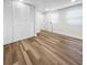 Bright bedroom featuring hardwood floors, a closet, and natural light from two windows at 2623 8Th St, Orlando, FL 32820