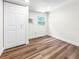 This bedroom features hardwood floors, a closet, and a window unit air conditioner at 2623 8Th St, Orlando, FL 32820