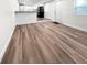 An open and spacious living area with laminate flooring, kitchen view and natural light at 2623 8Th St, Orlando, FL 32820