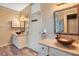 Dual vanities with vessel sinks and granite countertops in a well-lit bathroom at 2794 Cullens Ct, Ocoee, FL 34761