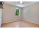 Neutral bedroom with laminate floors, window, ceiling fan, and natural light at 2794 Cullens Ct, Ocoee, FL 34761
