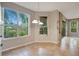 A breakfast nook has tile flooring, multiple windows with views, and a cabinet for storage at 2794 Cullens Ct, Ocoee, FL 34761