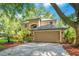 Charming home with a two-car garage and lush, tropical landscaping at 2794 Cullens Ct, Ocoee, FL 34761