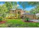 Beautiful two-story home with a well-manicured lawn and mature landscaping at 2794 Cullens Ct, Ocoee, FL 34761