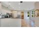 A kitchen featuring white cabinets, stainless steel appliances, tile flooring, and an island at 2794 Cullens Ct, Ocoee, FL 34761
