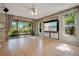 Open living space features hardwood floors and a large sliding glass doors at 2794 Cullens Ct, Ocoee, FL 34761