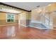 Bright living room with hardwood floors, staircase and large window at 2794 Cullens Ct, Ocoee, FL 34761