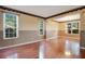 Spacious living room with gleaming hardwood floors and multiple windows at 2794 Cullens Ct, Ocoee, FL 34761