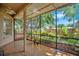 Inviting screened-in porch offering views of the beautifully landscaped backyard and greenery at 2794 Cullens Ct, Ocoee, FL 34761