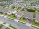 Scenic aerial view of a neighborhood featuring well-maintained homes and green lawns in a Gathering-friendly community at 2929 Bluestem Ln, Clermont, FL 34714