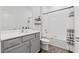 Well-lit bathroom with a vanity, toilet, and bathtub with white subway tile surround at 2929 Bluestem Ln, Clermont, FL 34714
