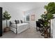 Bright bedroom featuring neutral colors, daybed, desk, and ample natural light at 2929 Bluestem Ln, Clermont, FL 34714